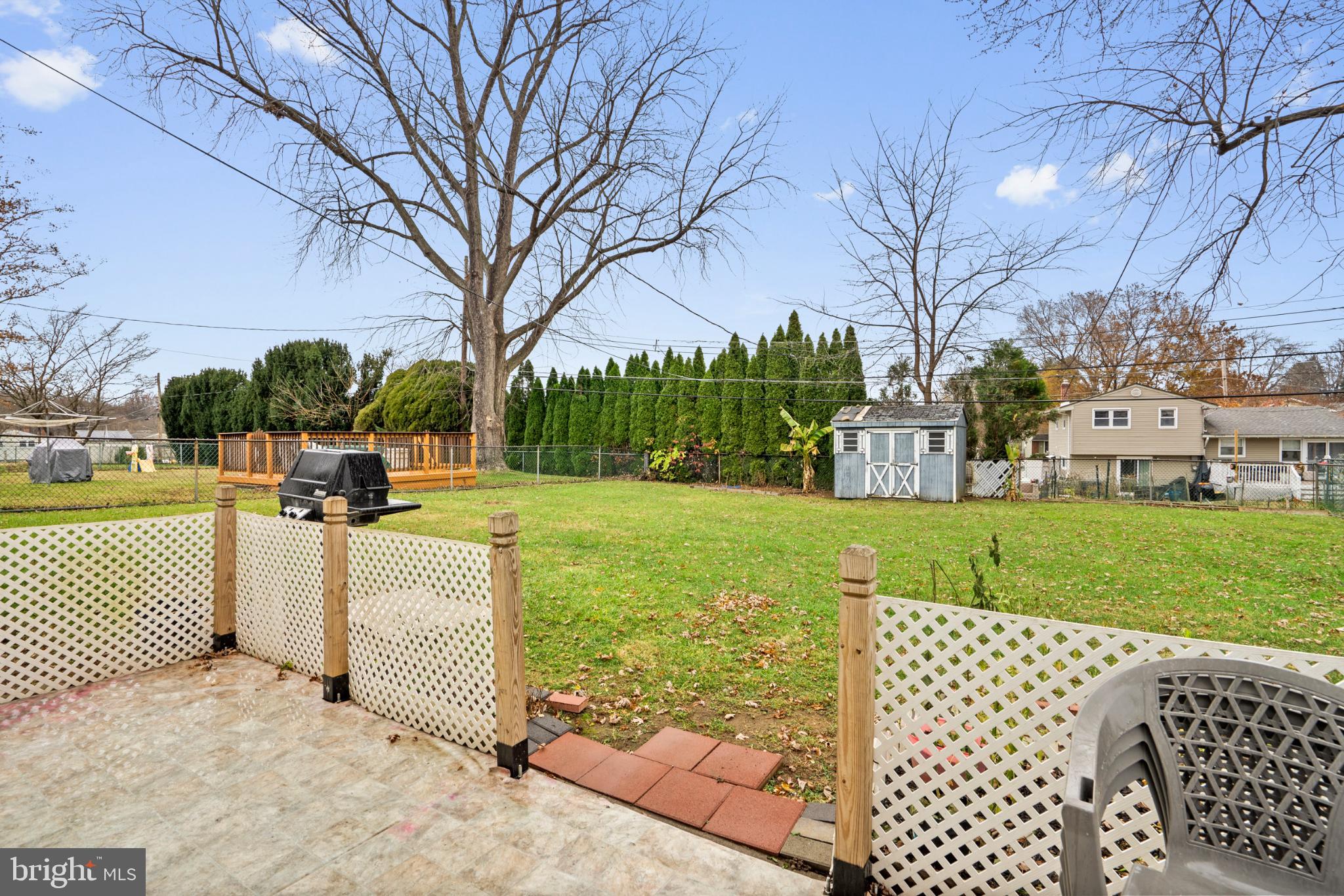 8912 Turton Drive Philadelphia, PA 19115 - Photo 27 of 34 Spacious backyard with lush greenery.