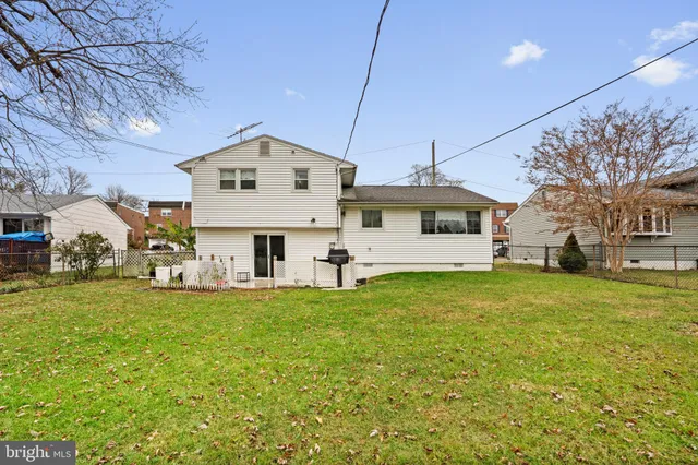 a front view of a house with a garden and deck