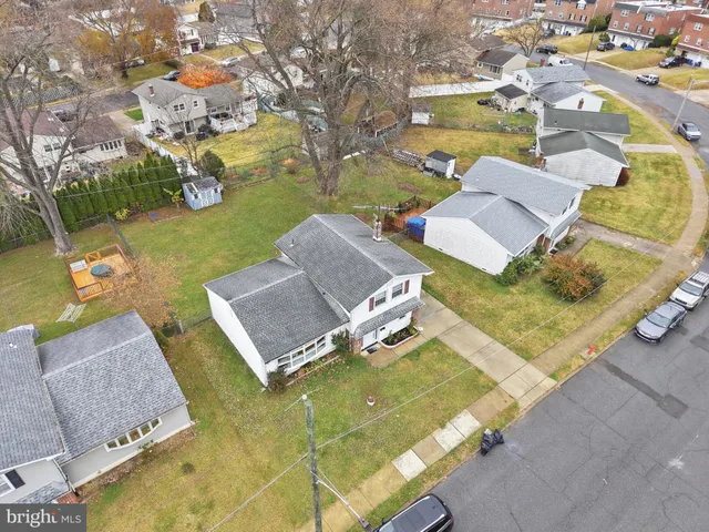 an aerial view of a house with swimming pool and outdoor space
