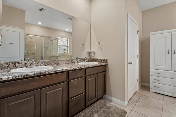 a balcony with furniture and a potted plant