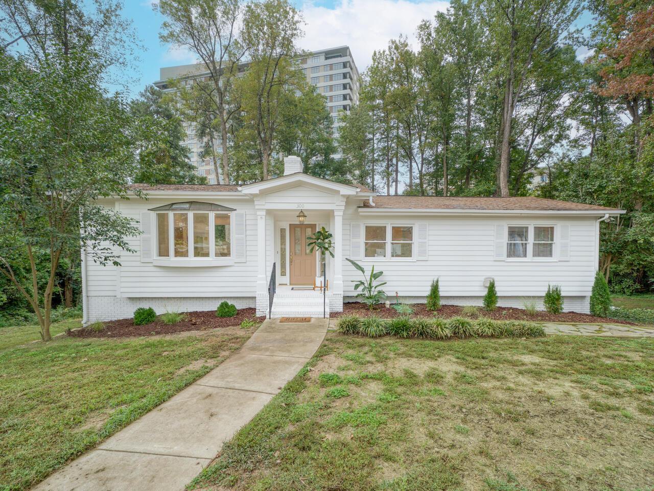 a view of a house with a backyard