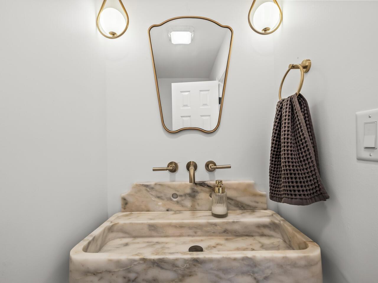 300 Dartmouth Road Raleigh, NC 27609 - Photo 12 of 28 a bathroom with a sink and mirror