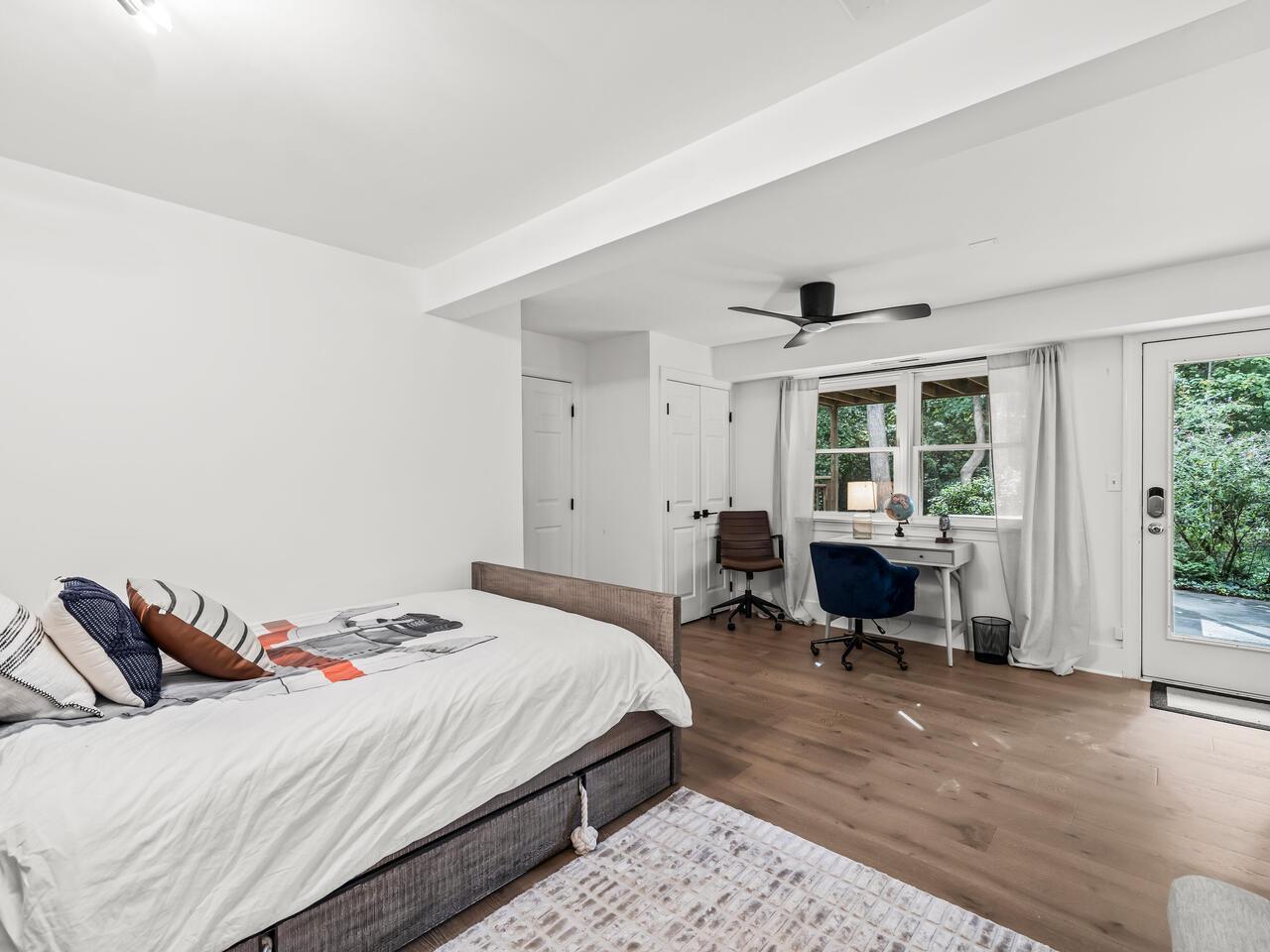 300 Dartmouth Road Raleigh, NC 27609 - Photo 22 of 28 a bedroom with a bed and a large window