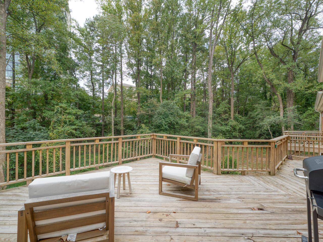 300 Dartmouth Road Raleigh, NC 27609 - Photo 24 of 28 a view of balcony with deck and outdoor seating