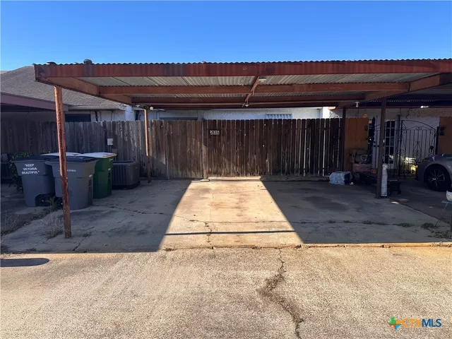 a view of backyard with sitting area