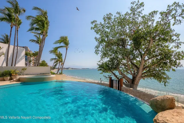 a view of yard with swimming pool and sitting area