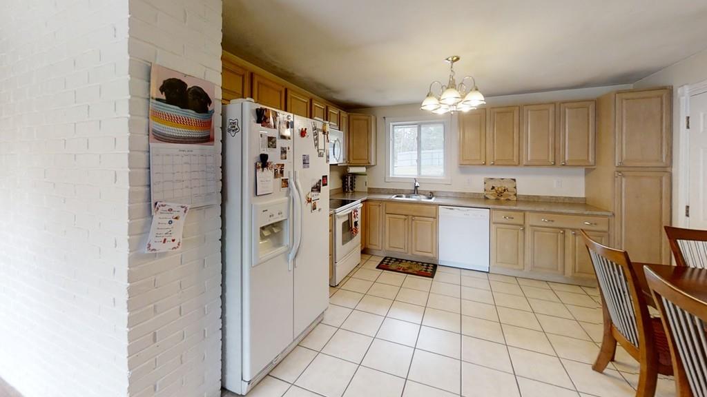78 Michael Road Raynham, MA 02767 - Photo 13 of 42 a kitchen with stainless steel appliances a refrigerator sink and cabinets