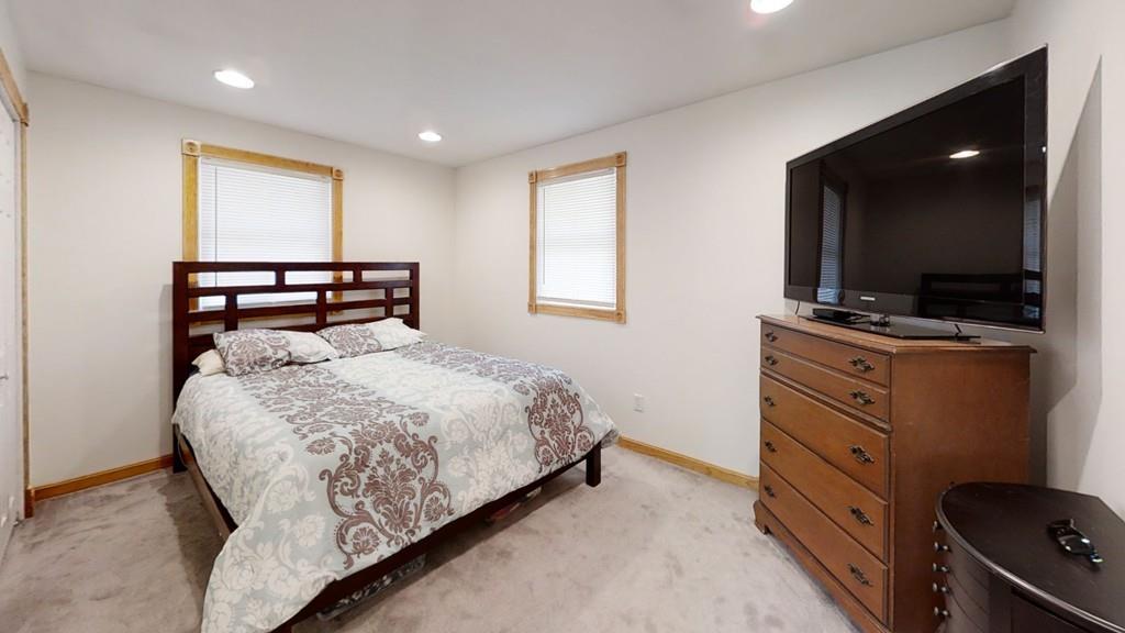 78 Michael Road Raynham, MA 02767 - Photo 17 of 42 a bedroom with a bed and flat screen tv