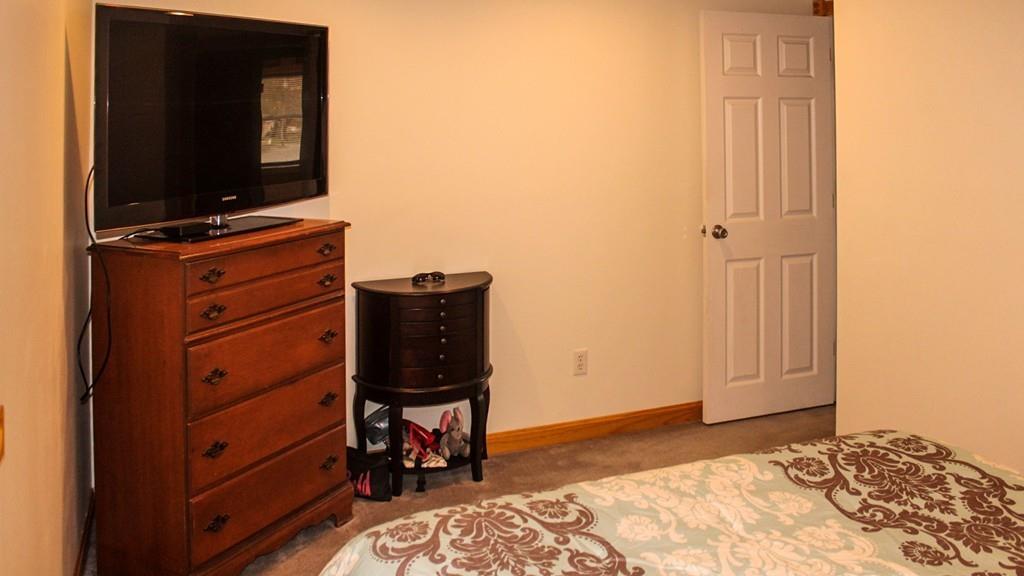 78 Michael Road Raynham, MA 02767 - Photo 20 of 42 a bedroom with a bed and television