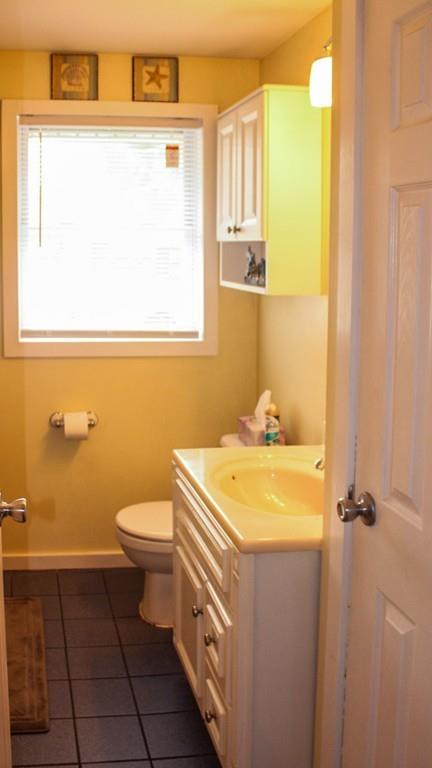 78 Michael Road Raynham, MA 02767 - Photo 23 of 42 a bathroom with a sink a toilet and a window