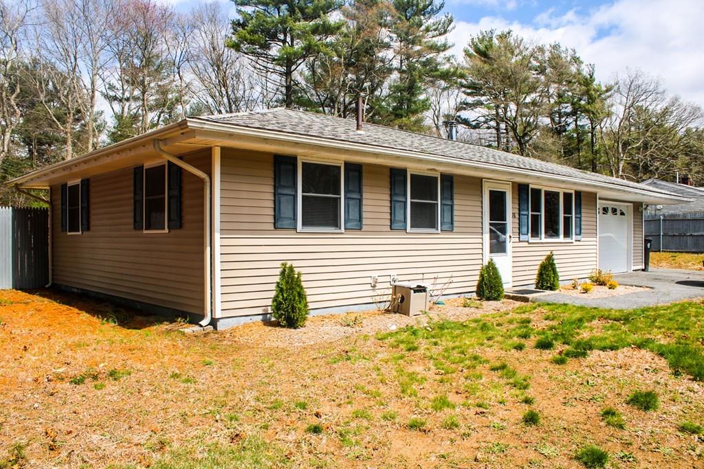 78 Michael Road Raynham, MA 02767 - Photo 3 of 42 a front view of a house with a yard and garage