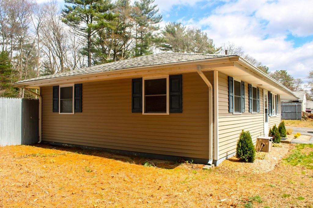 78 Michael Road Raynham, MA 02767 - Photo 4 of 42 a front view of a house with a yard