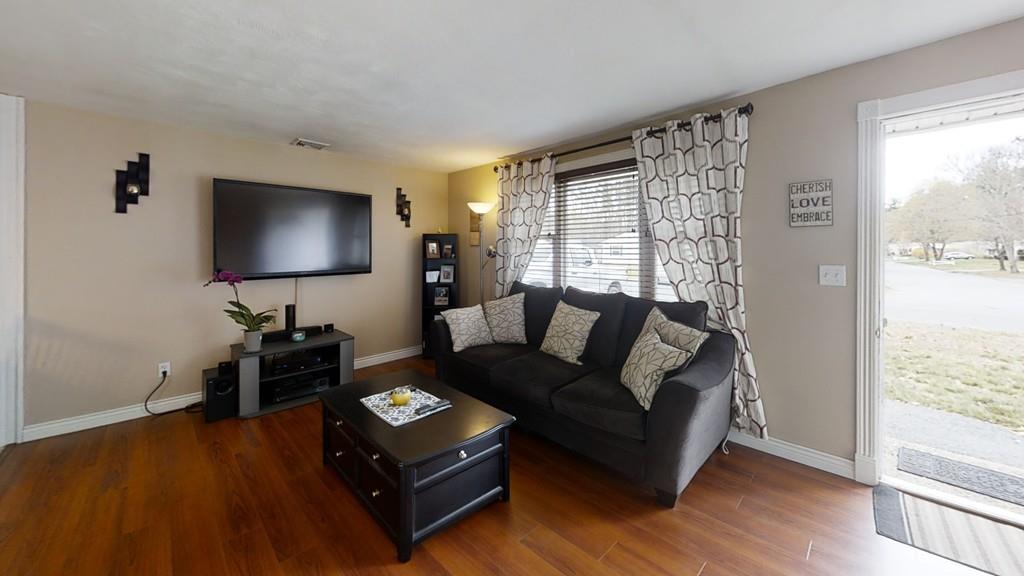 78 Michael Road Raynham, MA 02767 - Photo 5 of 42 a living room with furniture and a flat screen tv