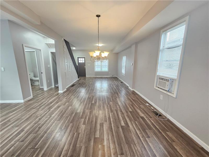 418 Short Street Donora, PA 15033 - Photo 5 of 12 a view of a room with wooden floor staircase and front door
