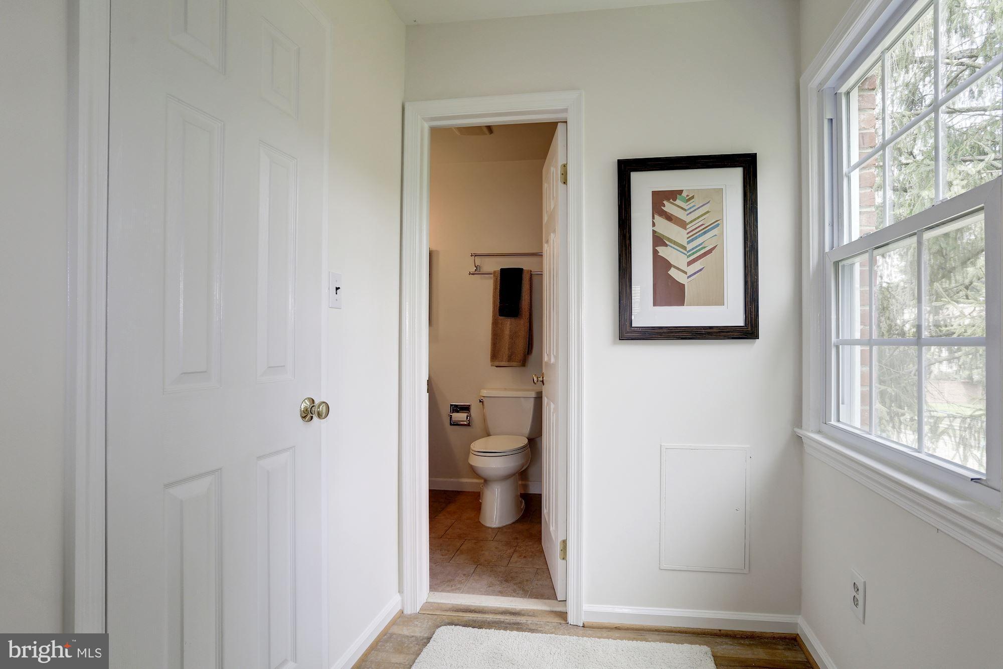 10239 Gainsborough Road Potomac, MD 20854 - Photo 14 of 21 a view of a hallway with toilet and a window