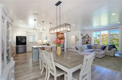 a kitchen with a table and chairs
