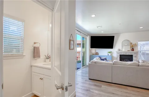 a view of a livingroom with furniture and a bedroom