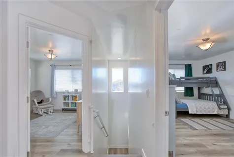 a bedroom with furniture and a book shelf
