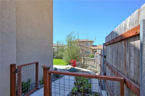 a view of balcony with furniture and umbrella