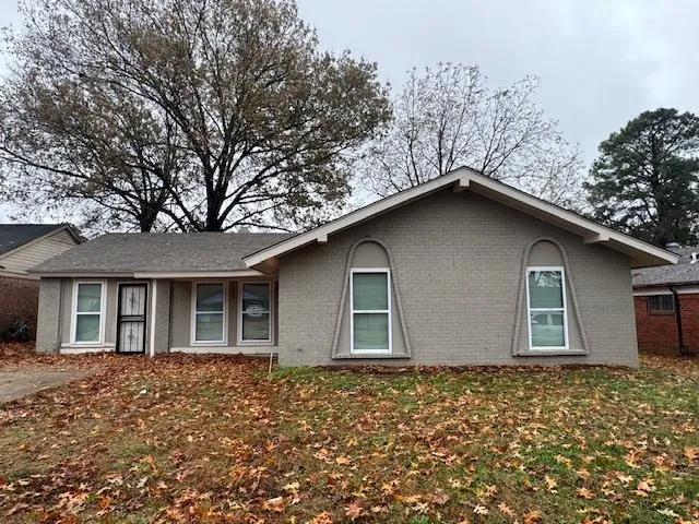 a house with trees in the background
