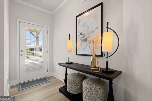 a living room with furniture and a mirror