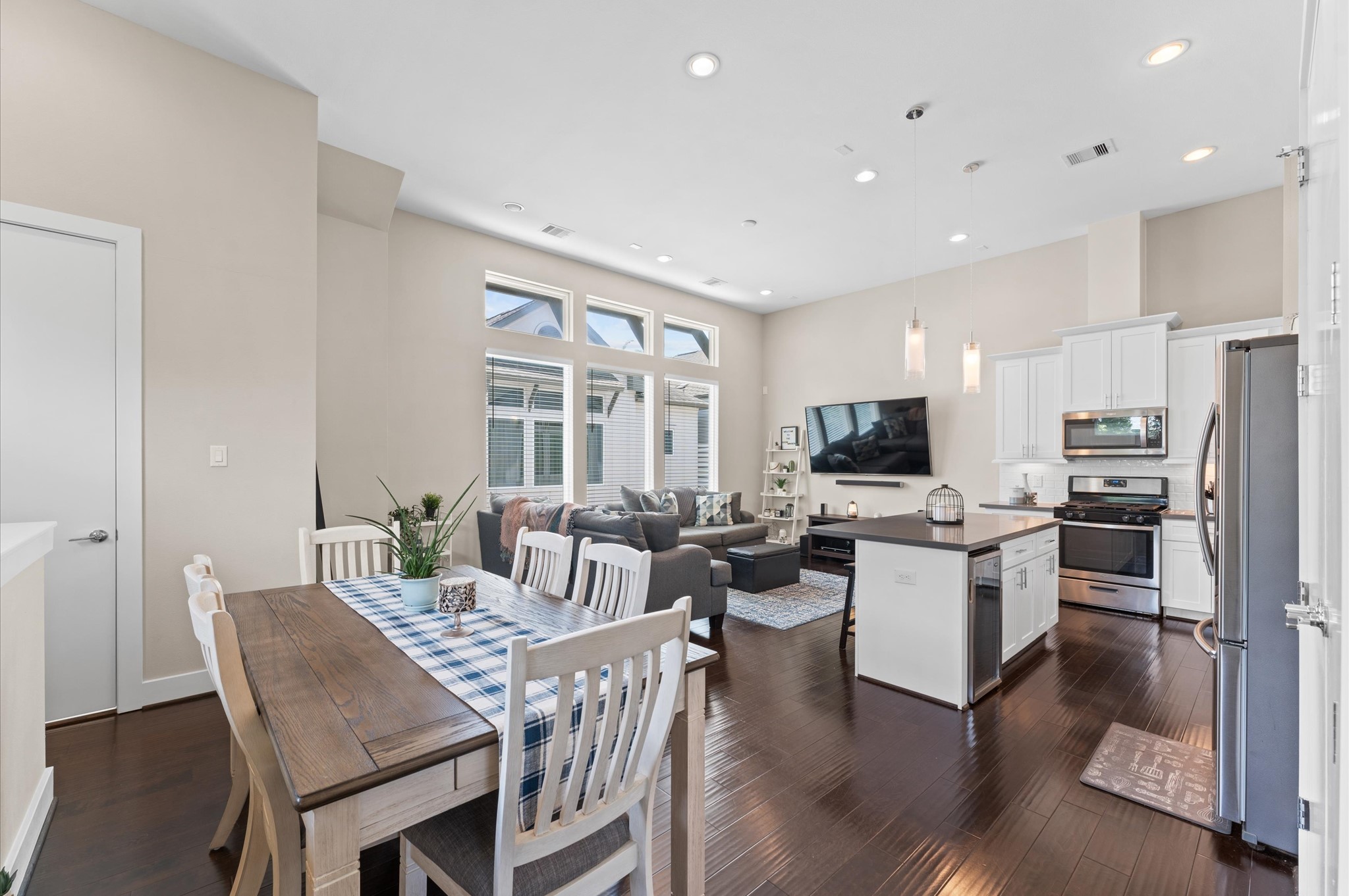 2422 Cochran Street Houston, TX 77009 - Photo 29 of 31 An inviting open floor plan joins the dining room, kitchen, and living room seamlessly with gorgeous floors! This is an ideal setup for entertaining.