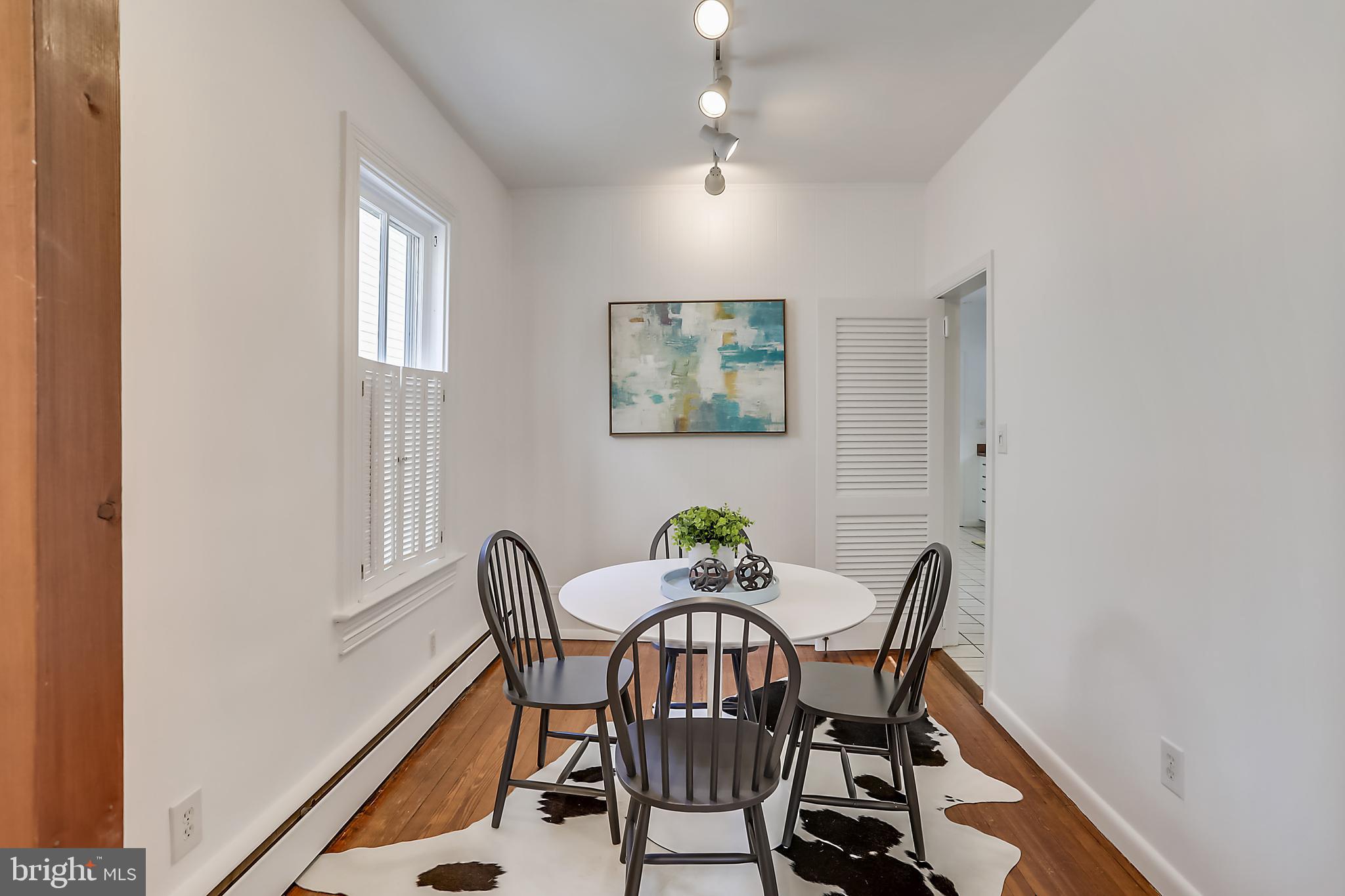 624 Ritchie Avenue Silver Spring, MD 20910 - Photo 13 of 46 Warm wooden floors and track lighting on a dimmer