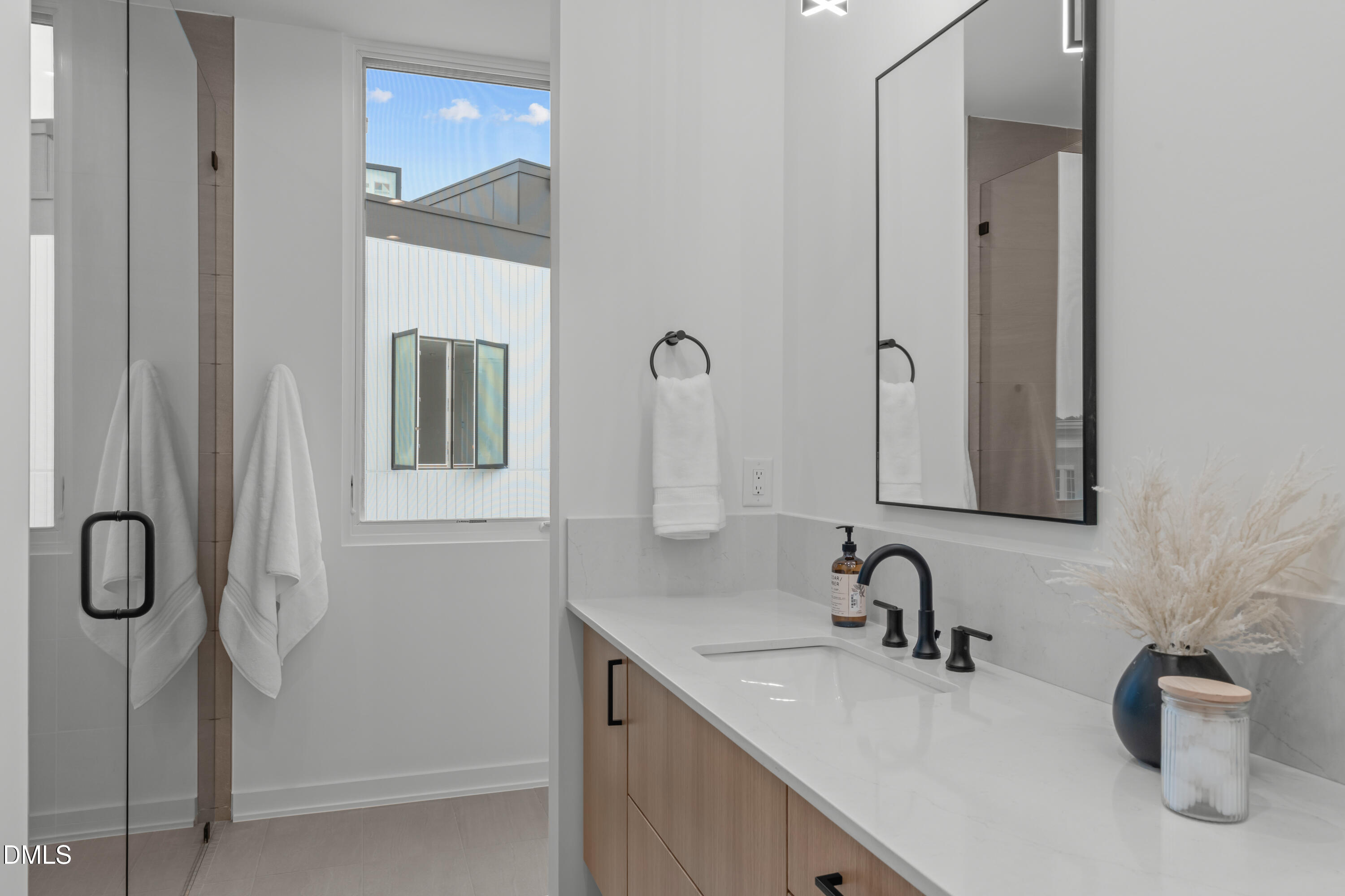 1307 Chamblee Hl Court Raleigh, NC 27608 - Photo 28 of 65 a bathroom with a sink and a mirror