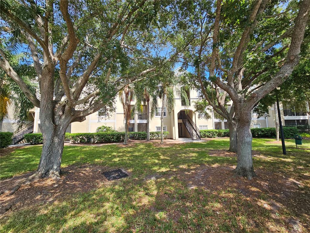 5174 Northridge Road, Unit 209 Sarasota, FL 34238 - Photo 3 of 25 a view of a trees in a yard