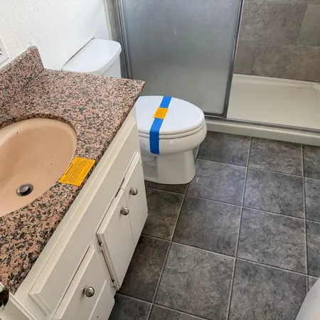 a bathroom with a sink a toilet and a bathtub