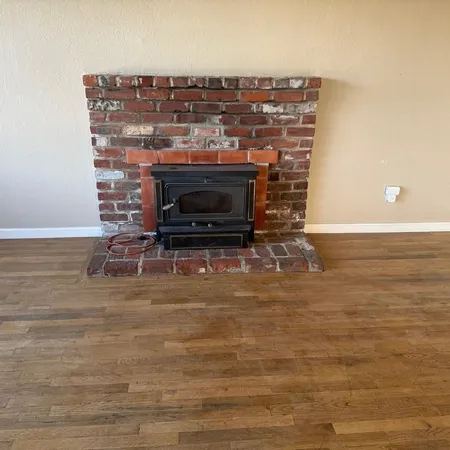 a living room with a fireplace and a table
