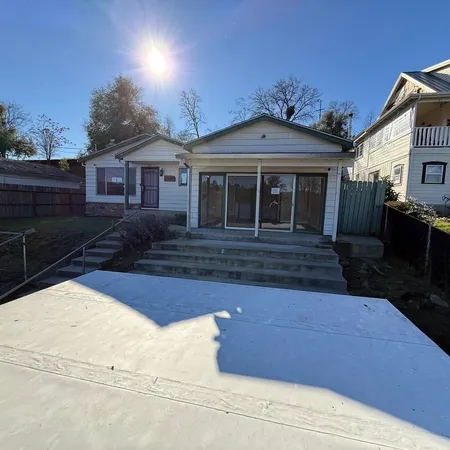 a front view of a house with yard