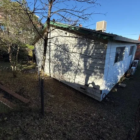 a view of a back yard of the house