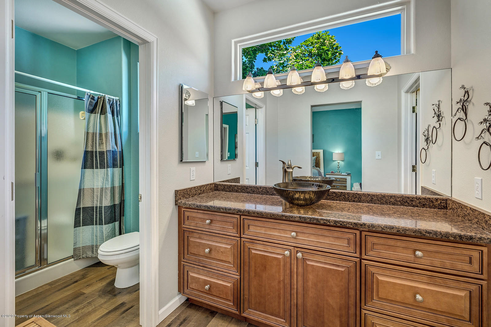 12 Poppy Court Parachute, CO 81635 - Photo 16 of 25 a bathroom with a granite countertop sink a toilet and shower