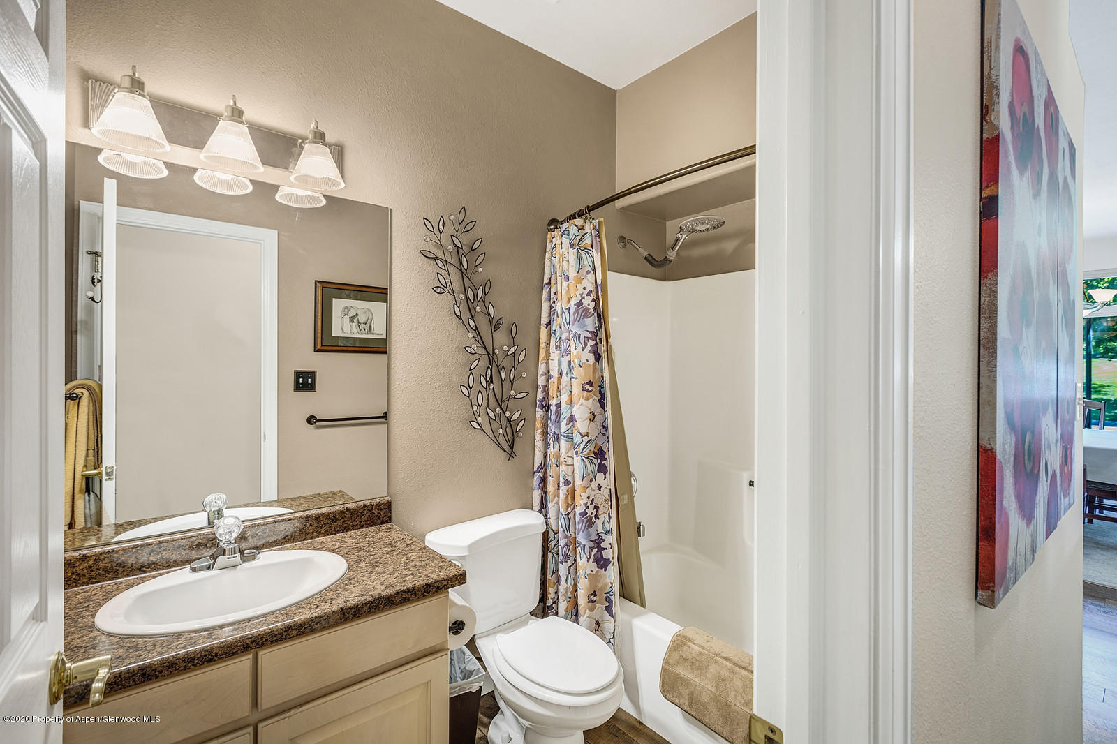 12 Poppy Court Parachute, CO 81635 - Photo 20 of 25 a bathroom with a sink a toilet a mirror and shower