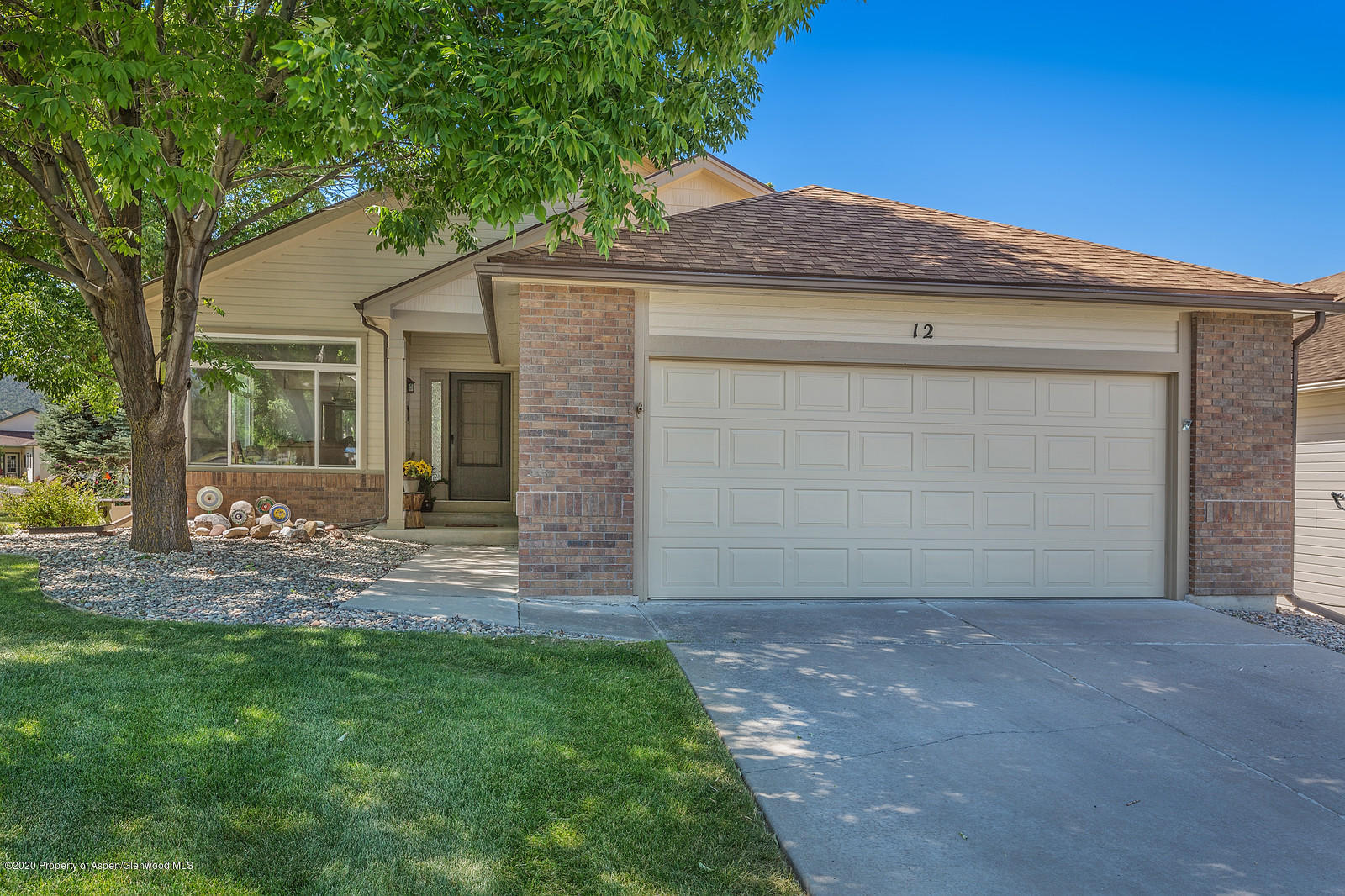 12 Poppy Court Parachute, CO 81635 - Photo 2 of 25 a front view of a house with a garden