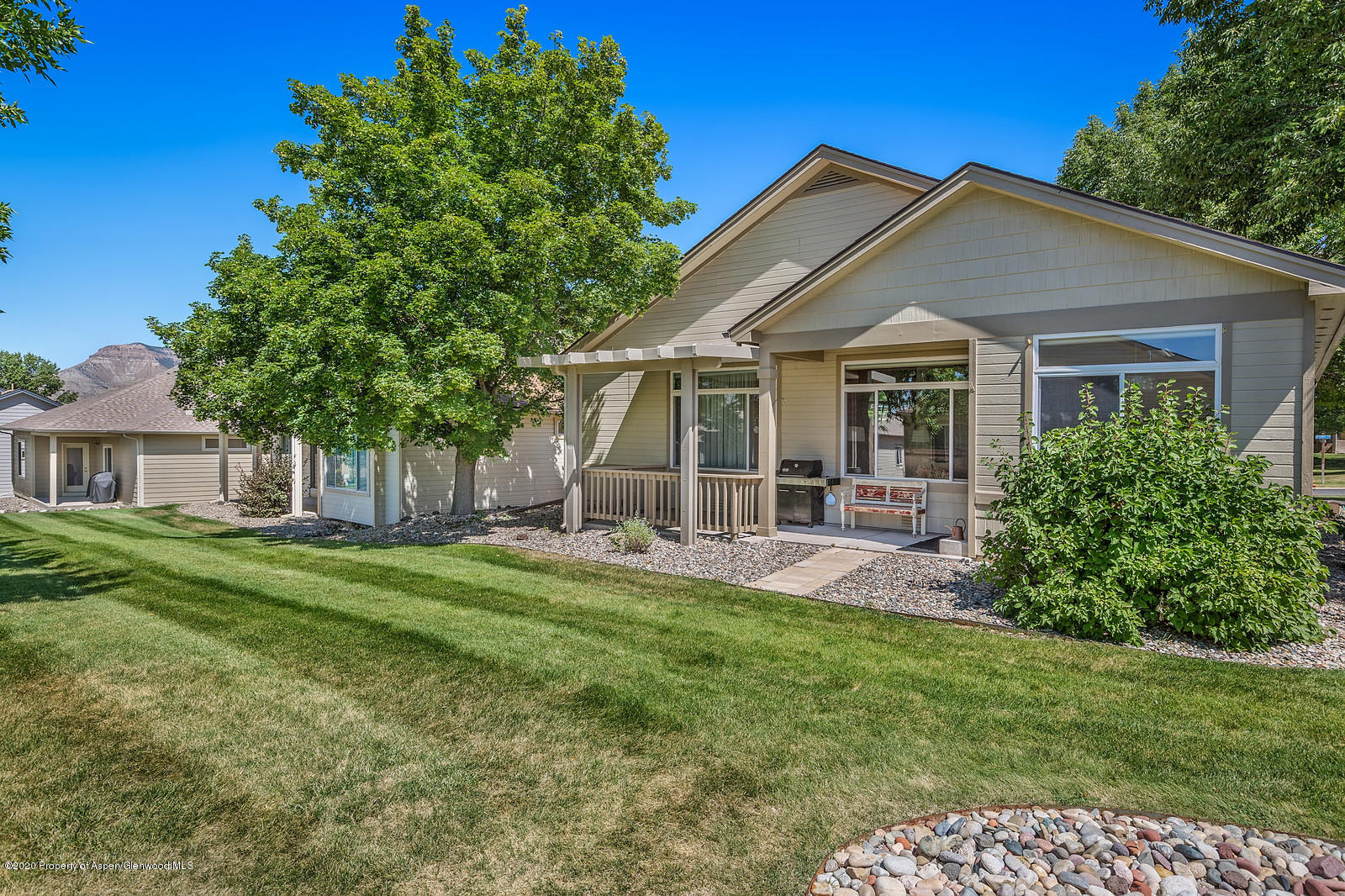 12 Poppy Court Parachute, CO 81635 - Photo 22 of 25 a view of a house with a big yard plants and large trees