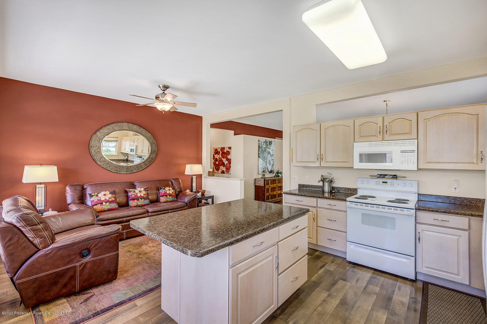 12 Poppy Court Parachute, CO 81635 - Photo 9 of 25 a kitchen with granite countertop a sink a stove and cabinets