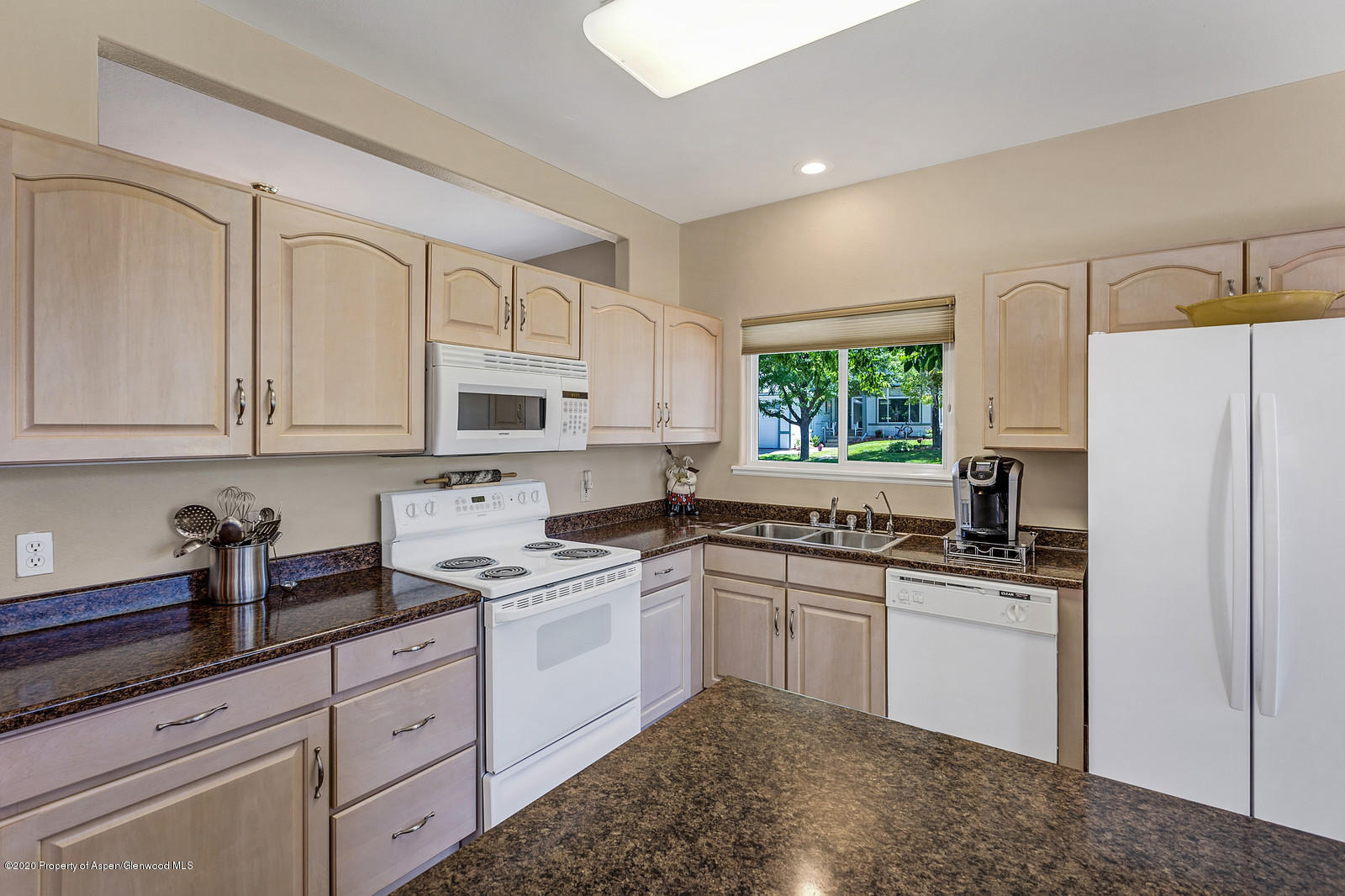 12 Poppy Court Parachute, CO 81635 - Photo 10 of 25 a kitchen with white cabinets and white appliances