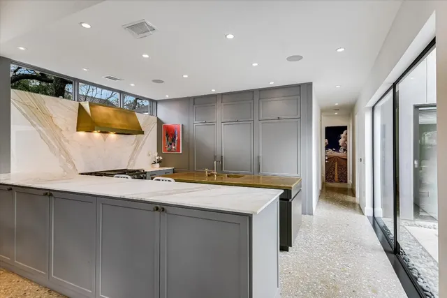 a bathroom with a double vanity sink mirror and shower