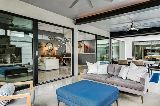 a living room with furniture and a potted plant