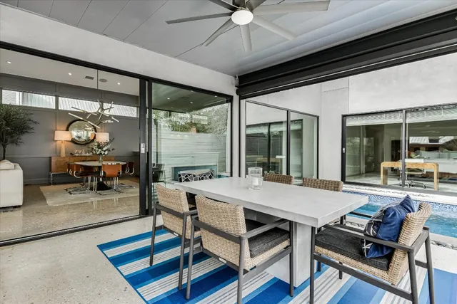 a bathroom with a granite countertop sink a mirror a shower and a bathtub