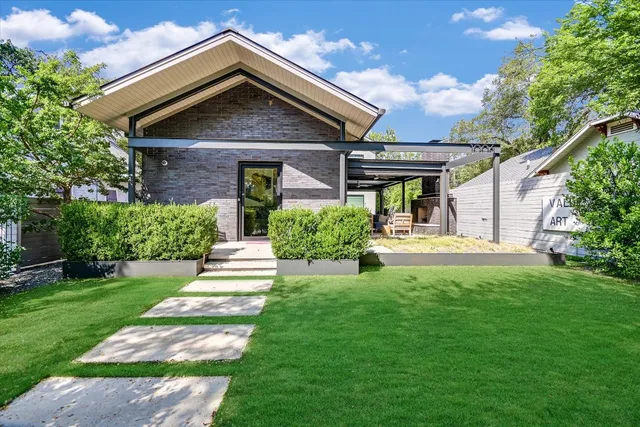 a view of a swimming pool with a yard