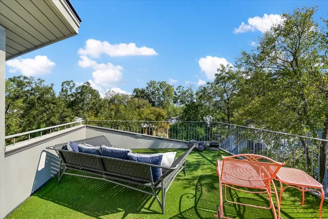 a view of a door and chair in the patio