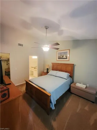 a bed room with a bed and a tv