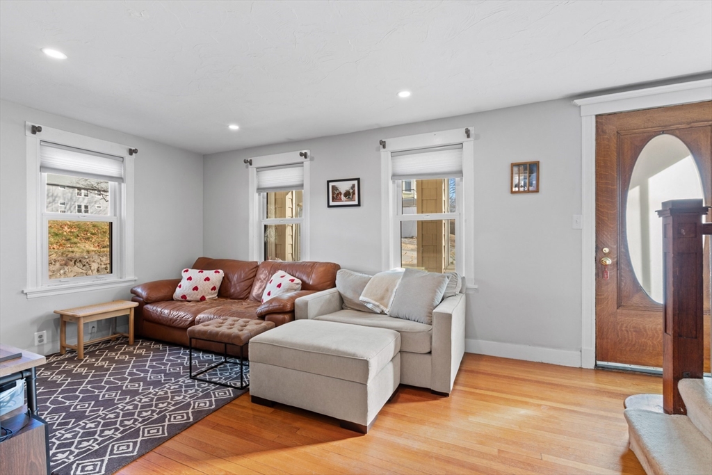 41 Baker Avenue Lexington, MA 02421 - Photo 11 of 21 a living room with furniture and a window