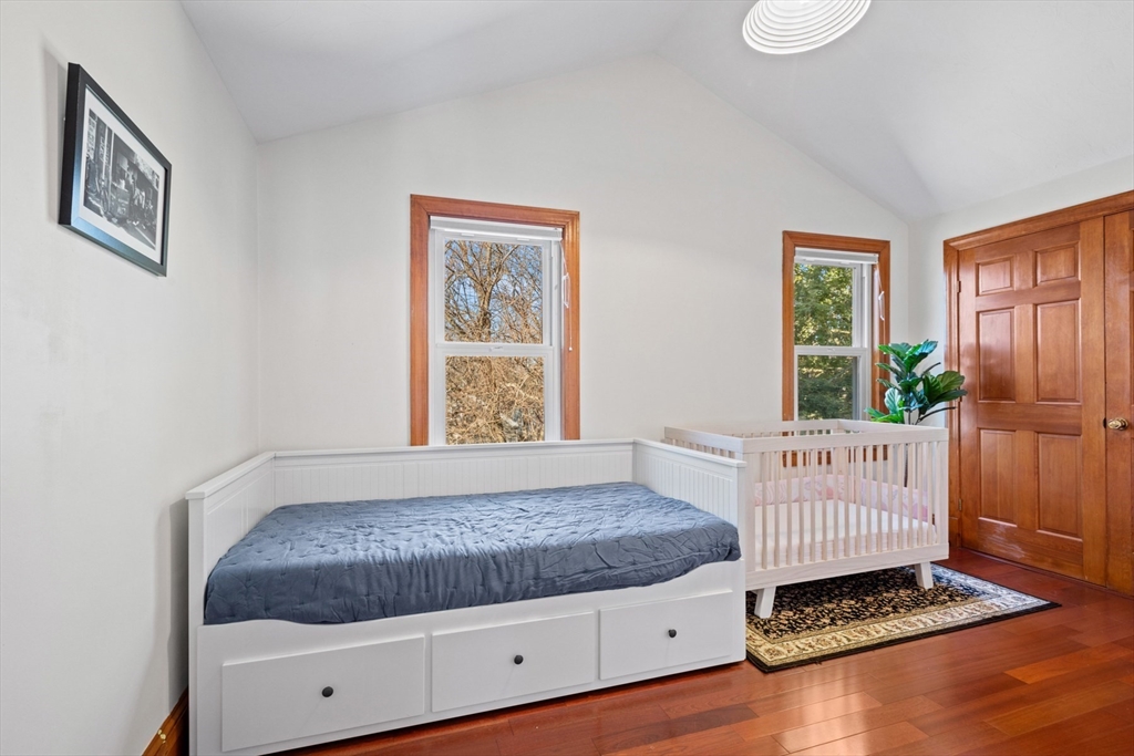 41 Baker Avenue Lexington, MA 02421 - Photo 13 of 21 a bedroom with a bed and window