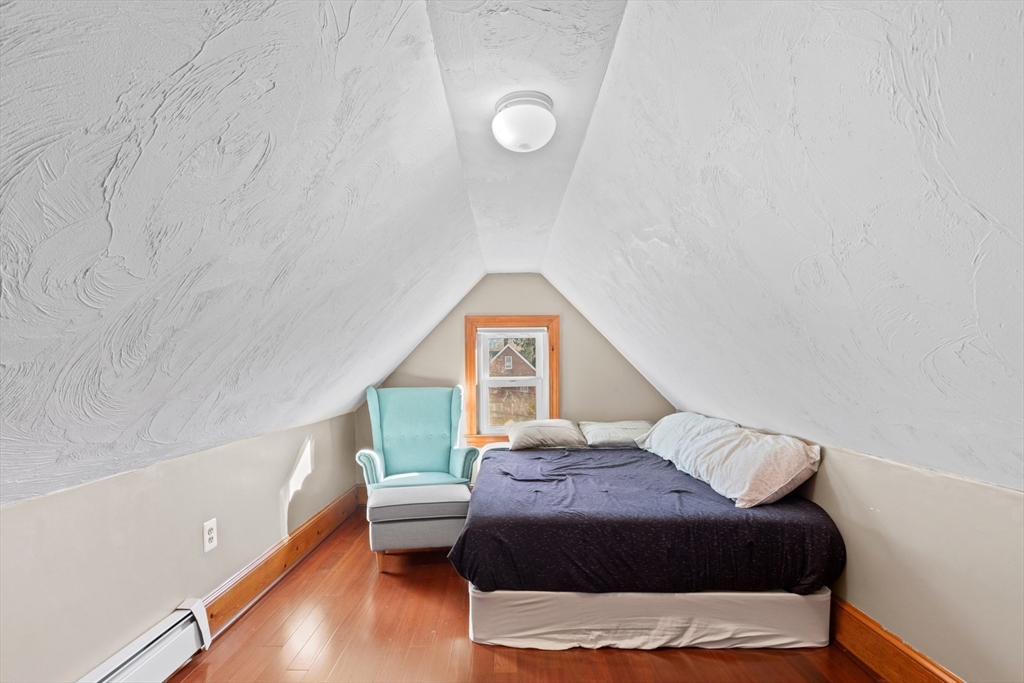 41 Baker Avenue Lexington, MA 02421 - Photo 17 of 21 a bedroom with a bed and a window