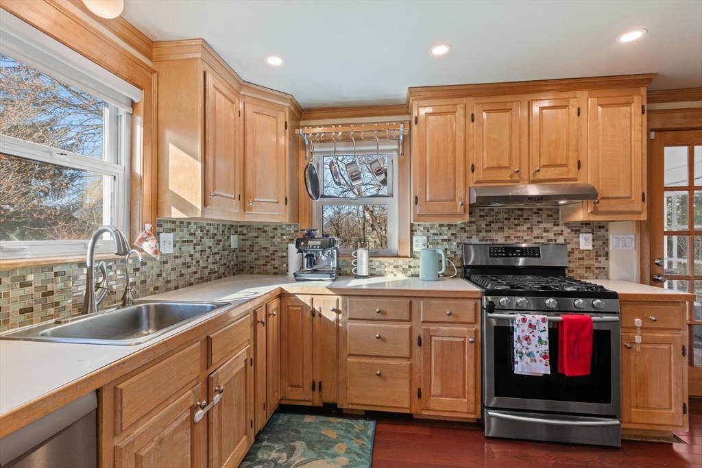 41 Baker Avenue Lexington, MA 02421 - Photo 3 of 21 a kitchen with stainless steel appliances granite countertop a sink stove and cabinets