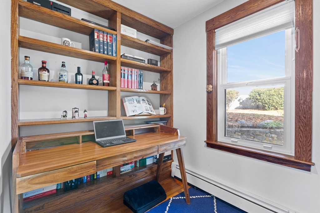 41 Baker Avenue Lexington, MA 02421 - Photo 10 of 21 a room with a bookshelf and a window